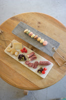 White marble cutting board with rope handle